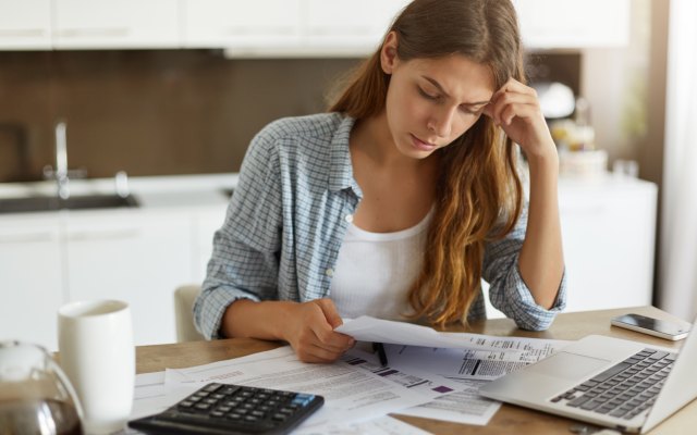 Woman looking at a bill