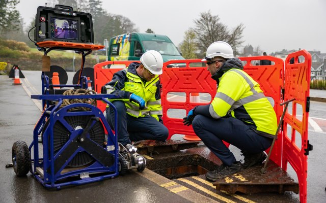 Engineers working on a smart sewer