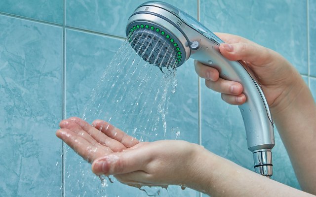 Holding a running shower head